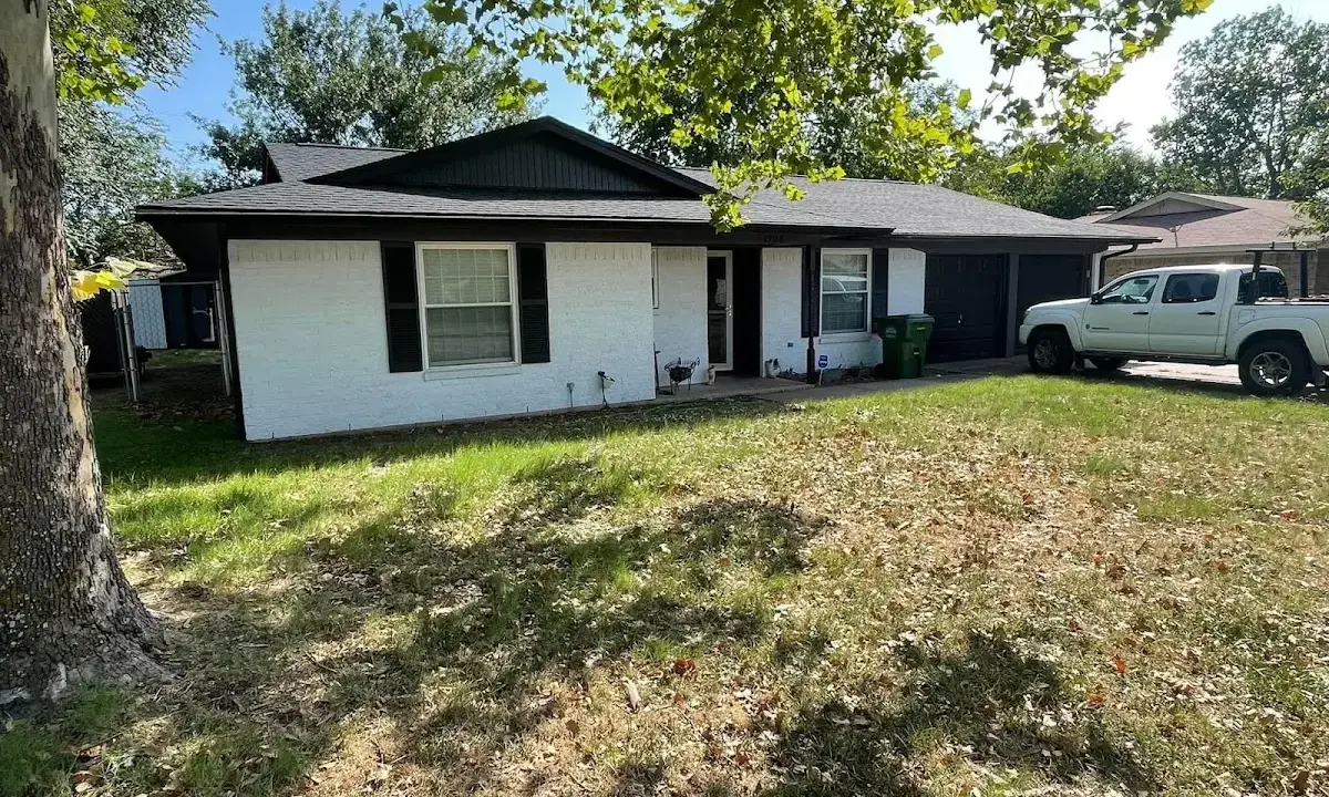 Professional roofing crew working on a residential roof in Tamaqua